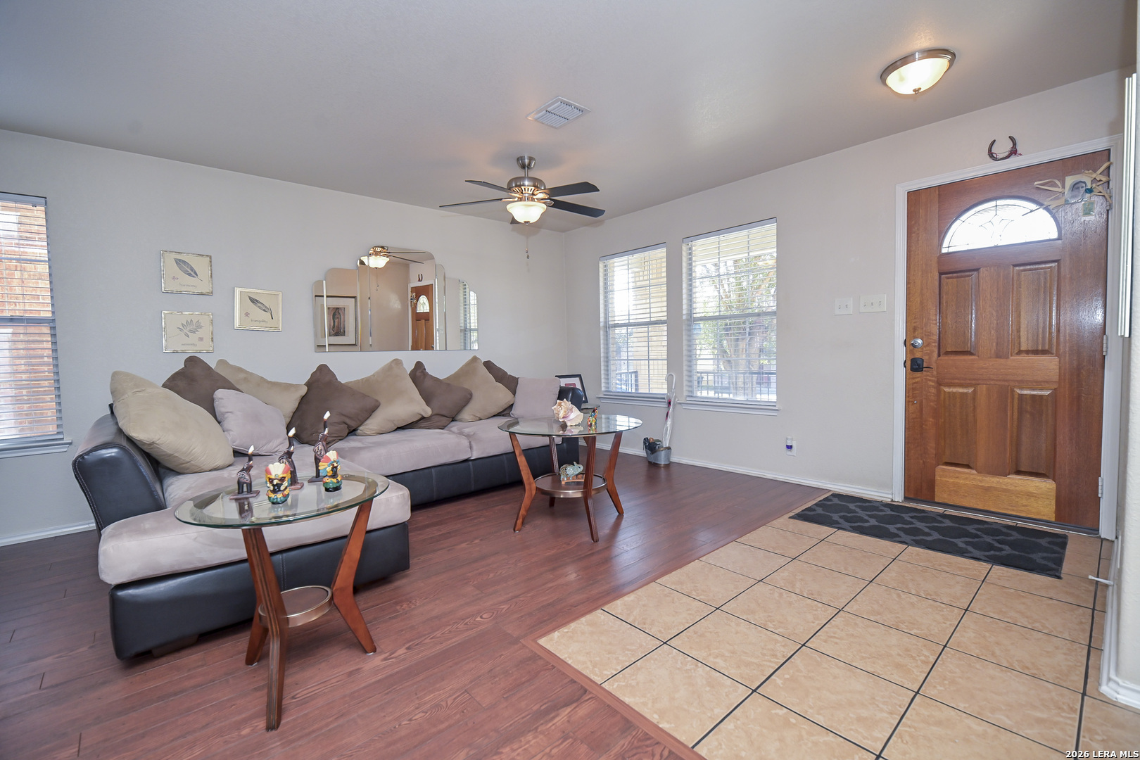 7207 Avery Road Live Oak, TX 78233 - Photo 6 of 42 a living room with furniture a dining table and a chandelier