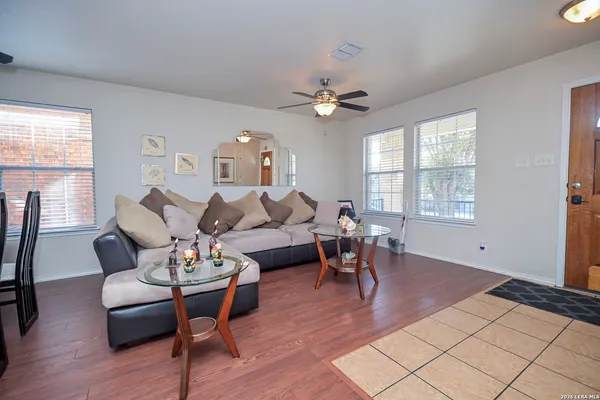 a living room with furniture dining table and a window