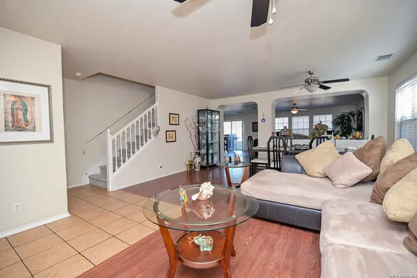a living room with furniture and a table
