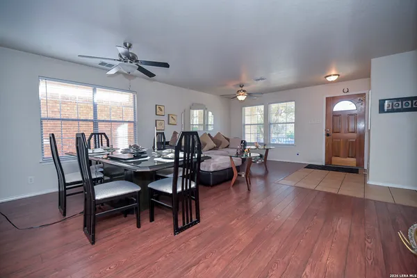 a view of a dining room with furniture window and wooden floor