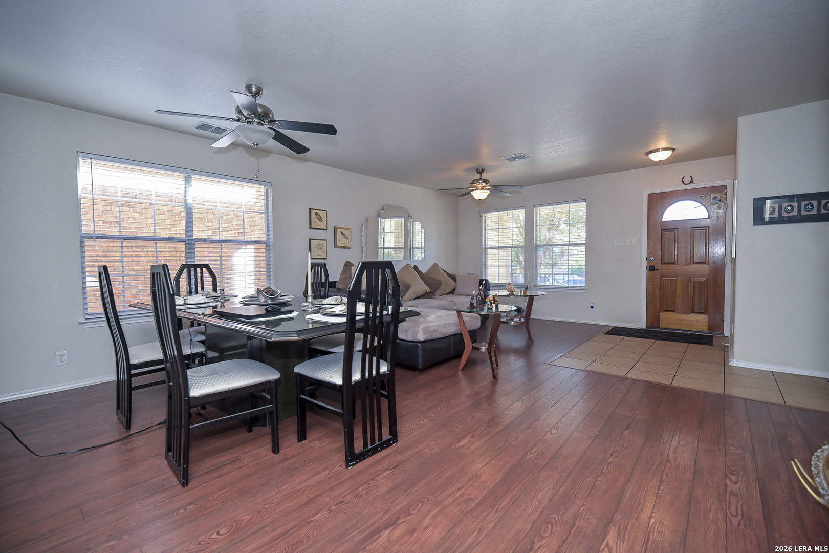 7207 Avery Road Live Oak, TX 78233 - Photo 10 of 42 a view of a dining room with furniture window and wooden floor