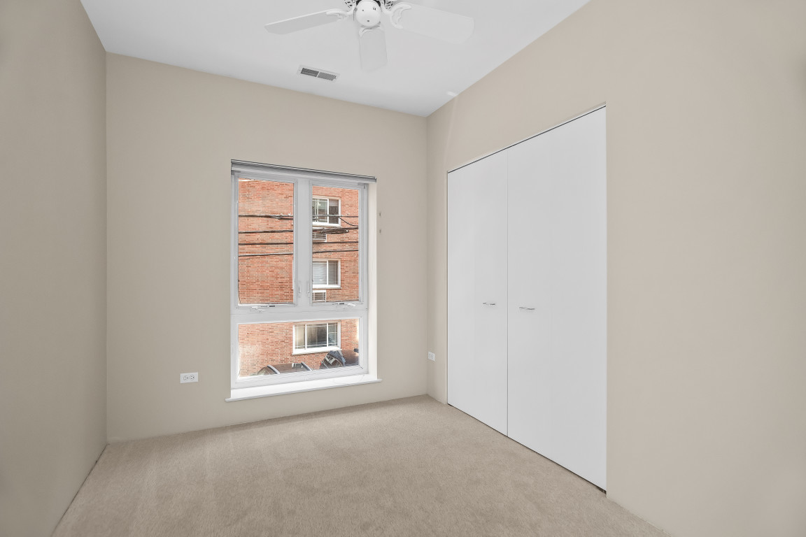 1415 Sherman Avenue, Unit 207 Evanston, IL 60201 - Photo 12 of 25 a view of an empty room with a window