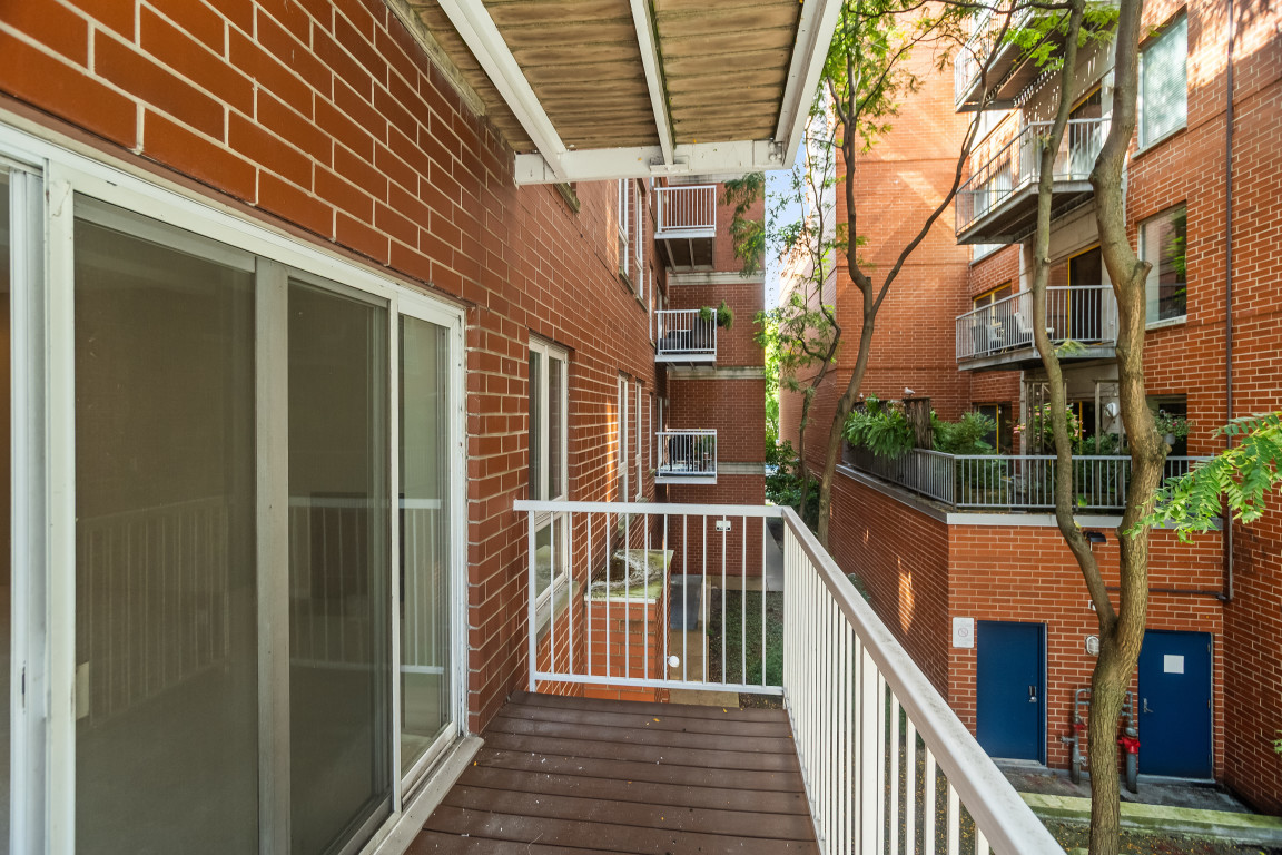1415 Sherman Avenue, Unit 207 Evanston, IL 60201 - Photo 17 of 25 a view of balcony with wooden floor and fence