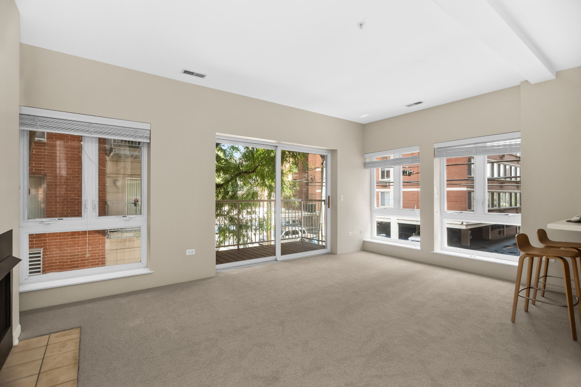 1415 Sherman Avenue, Unit 207 Evanston, IL 60201 - Photo 3 of 25 a view of an empty room with a window