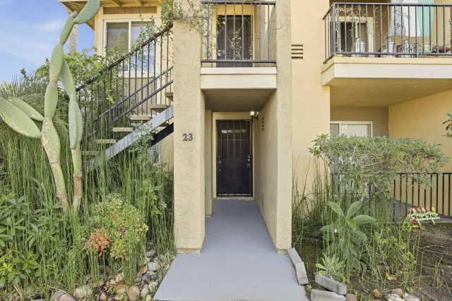 a view of a house with a small yard