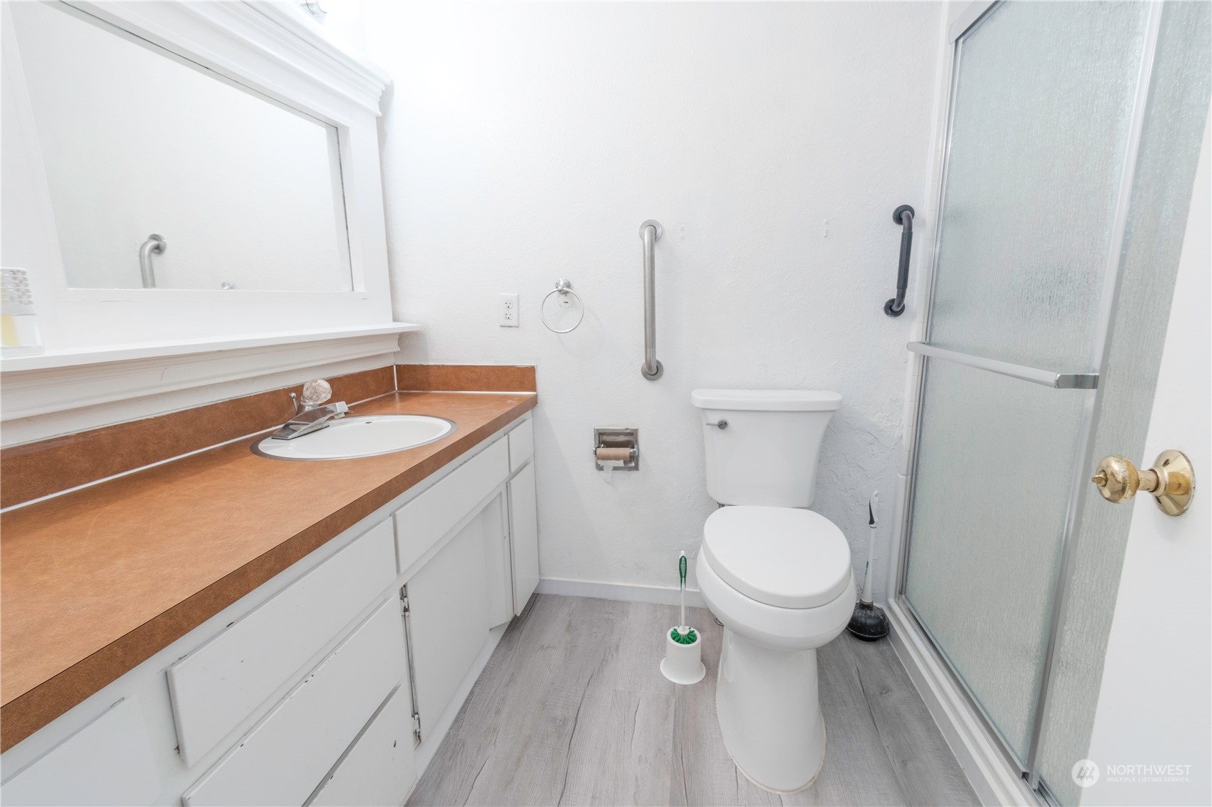 7154 Mecklem Road Everson, WA 98247 - Photo 12 of 25 a bathroom with a granite countertop toilet sink and mirror