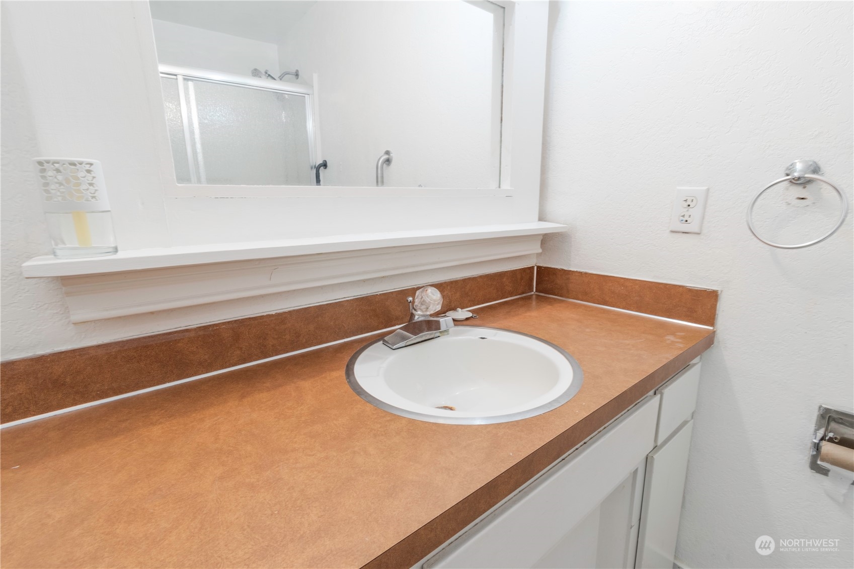 7154 Mecklem Road Everson, WA 98247 - Photo 13 of 25 a bathroom with a sink and a mirror