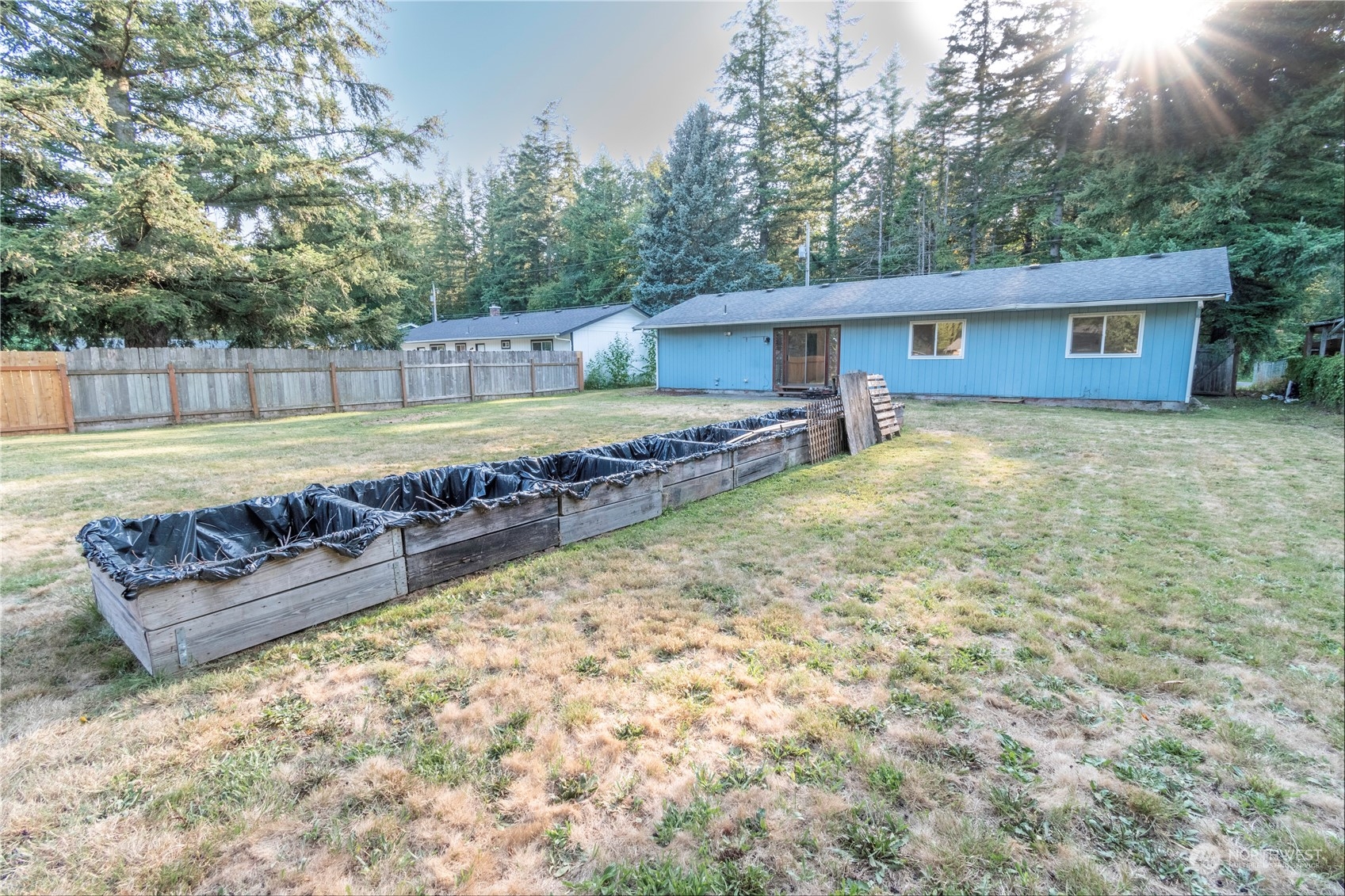 7154 Mecklem Road Everson, WA 98247 - Photo 25 of 25 a view of a house with a yard and a large tree
