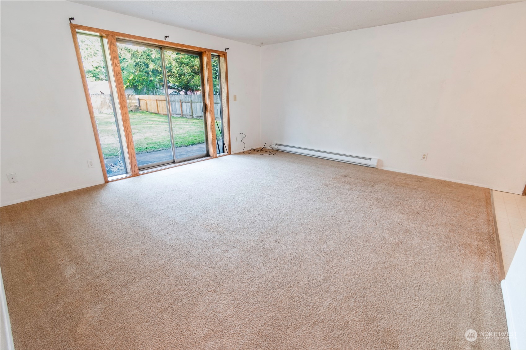 7154 Mecklem Road Everson, WA 98247 - Photo 6 of 25 an empty room with wooden floor and windows
