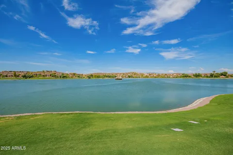 a view of a lake with a big yard