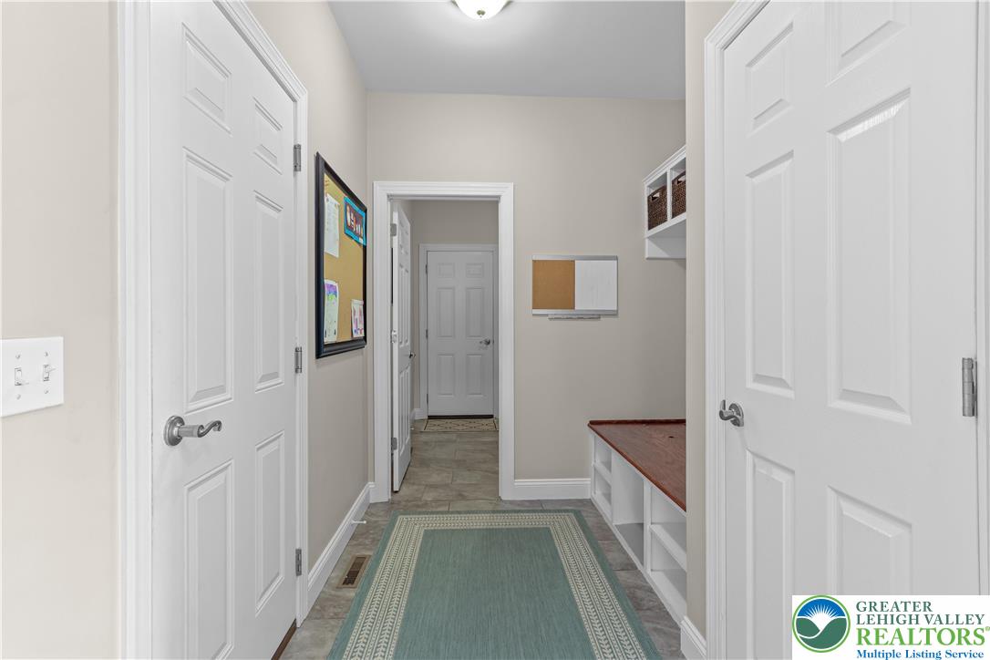 113 Ashview Court Nazareth, PA 18064 - Photo 21 of 41 a view of a hallway with wooden floor and staircase
