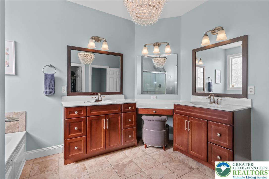 113 Ashview Court Nazareth, PA 18064 - Photo 27 of 41 a spacious bathroom with a granite countertop double vanity sink and a mirror