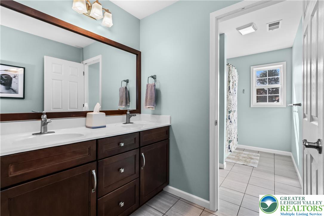 113 Ashview Court Nazareth, PA 18064 - Photo 36 of 41 a bathroom with a double vanity sink and a mirror