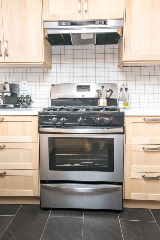 84 Bemis Road Holyoke, MA 01040 - Photo 13 of 30 a stove top oven sitting inside of a kitchen