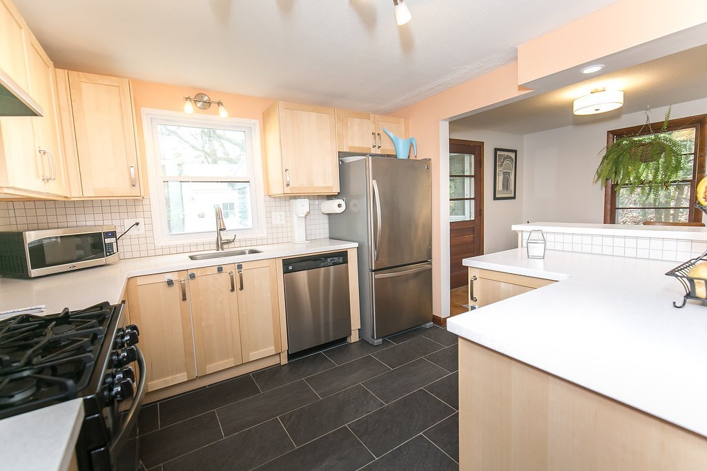 84 Bemis Road Holyoke, MA 01040 - Photo 14 of 30 a kitchen with a sink a refrigerator and a stove