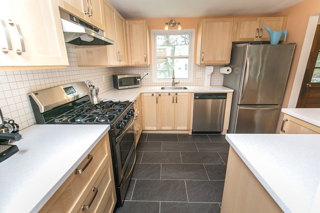 84 Bemis Road Holyoke, MA 01040 - Photo 17 of 30 a kitchen with a stove a refrigerator and a sink