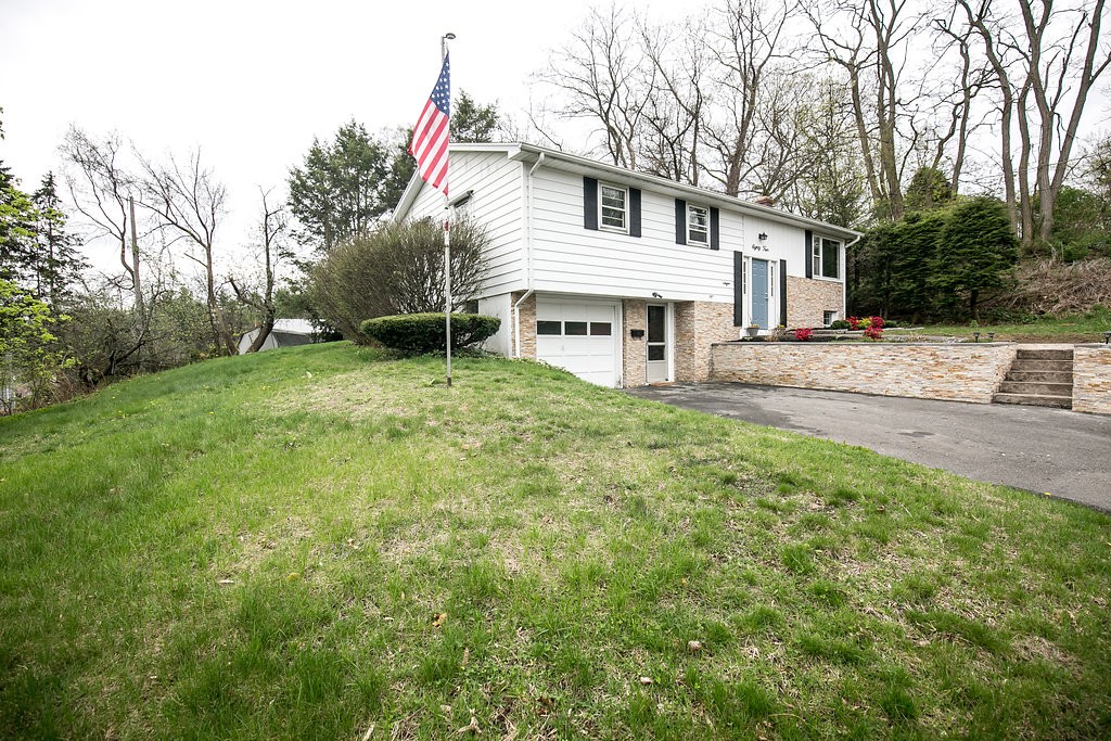 84 Bemis Road Holyoke, MA 01040 - Photo 2 of 30 a white house that has a tree in front of it