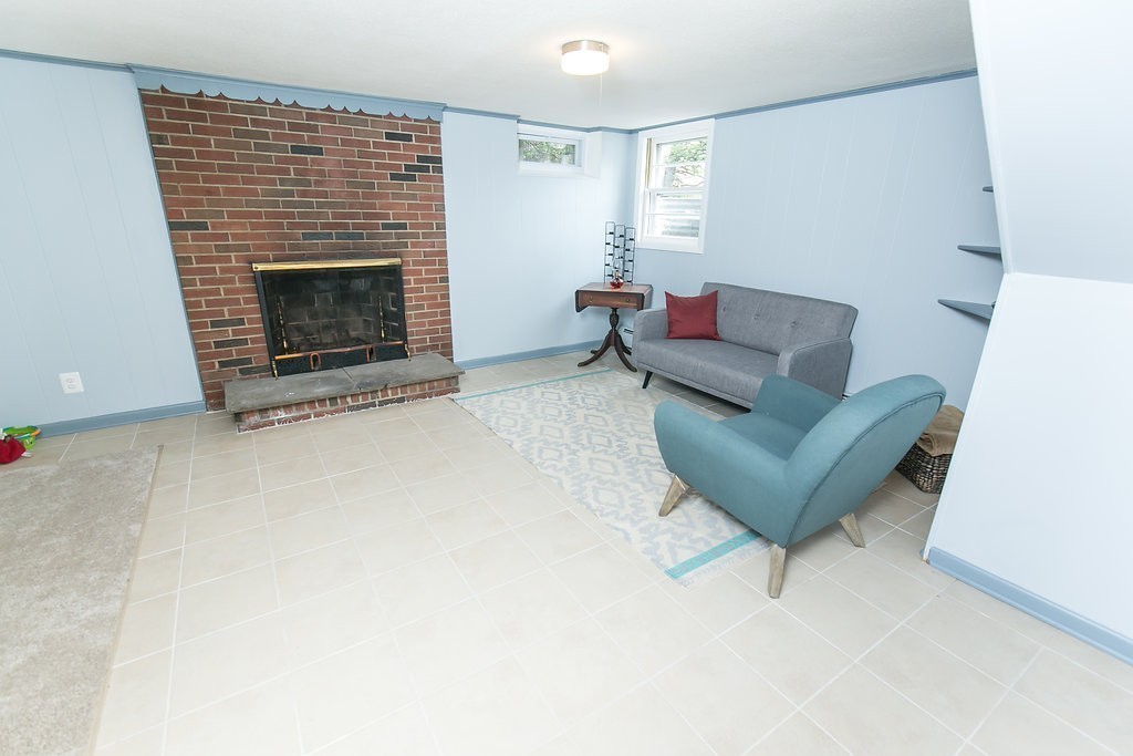 84 Bemis Road Holyoke, MA 01040 - Photo 27 of 30 a living room with furniture and a fireplace