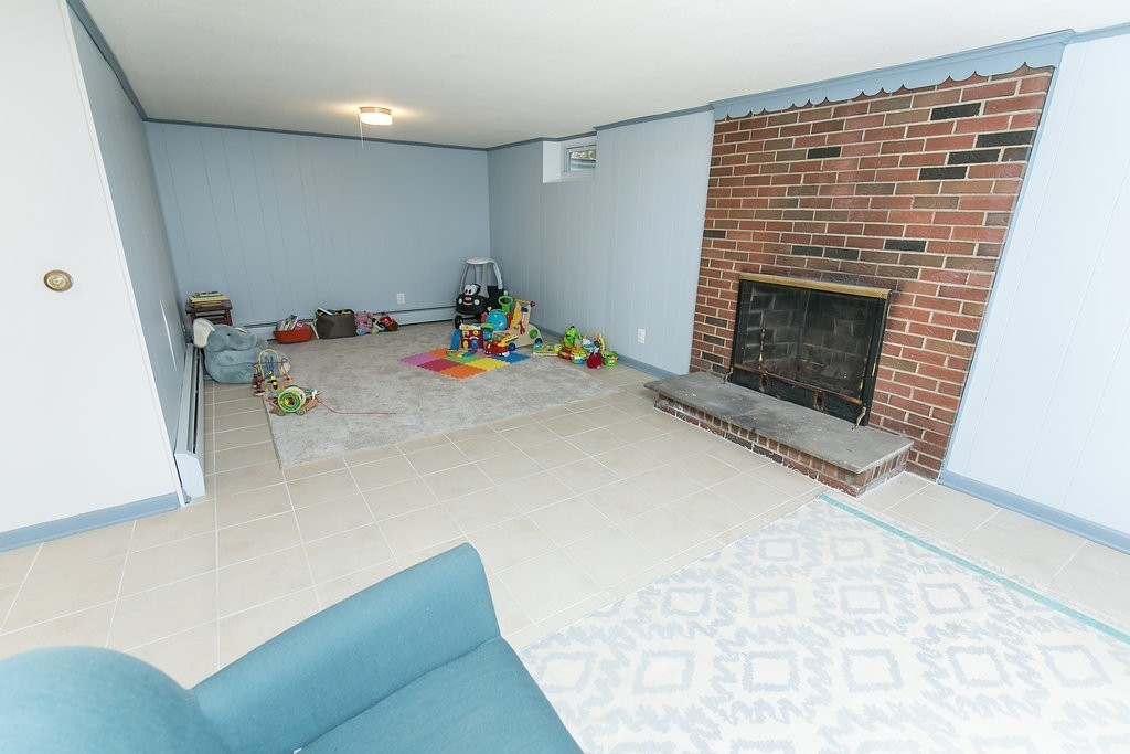 84 Bemis Road Holyoke, MA 01040 - Photo 28 of 30 a living room with furniture and a fireplace