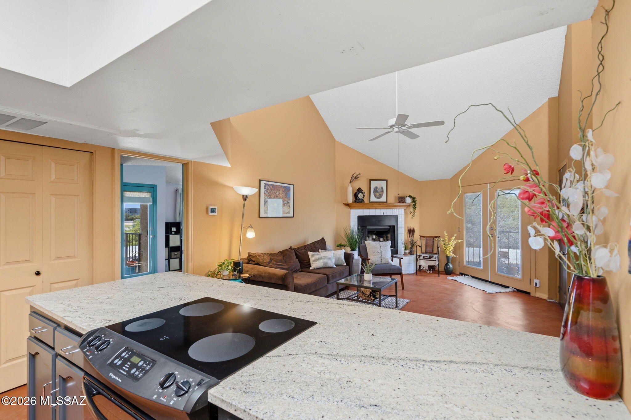 1200 East River Road, Unit G87 Tucson, AZ 85718 - Photo 13 of 30 a living room with furniture and flat screen tv