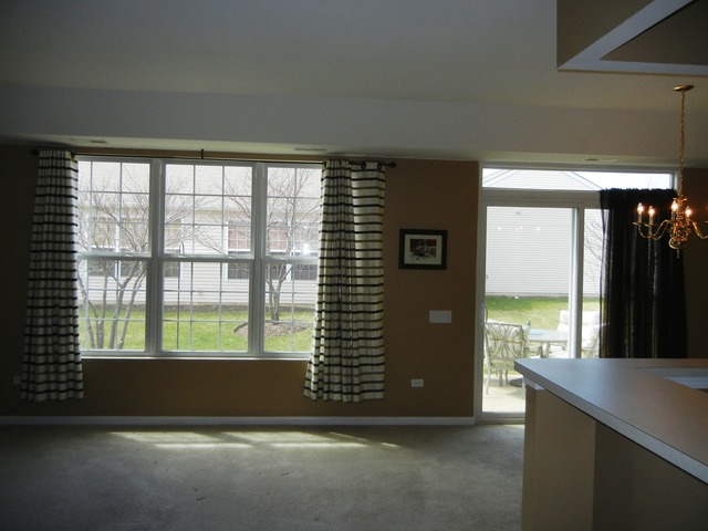 13468 Delaney Road Huntley, IL 60142 - Photo 2 of 17 a view of an empty room with a window