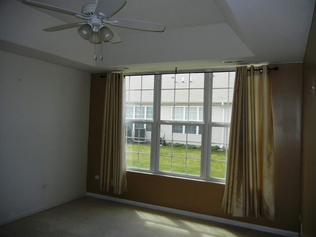 13468 Delaney Road Huntley, IL 60142 - Photo 13 of 17 a view of an empty room with a window