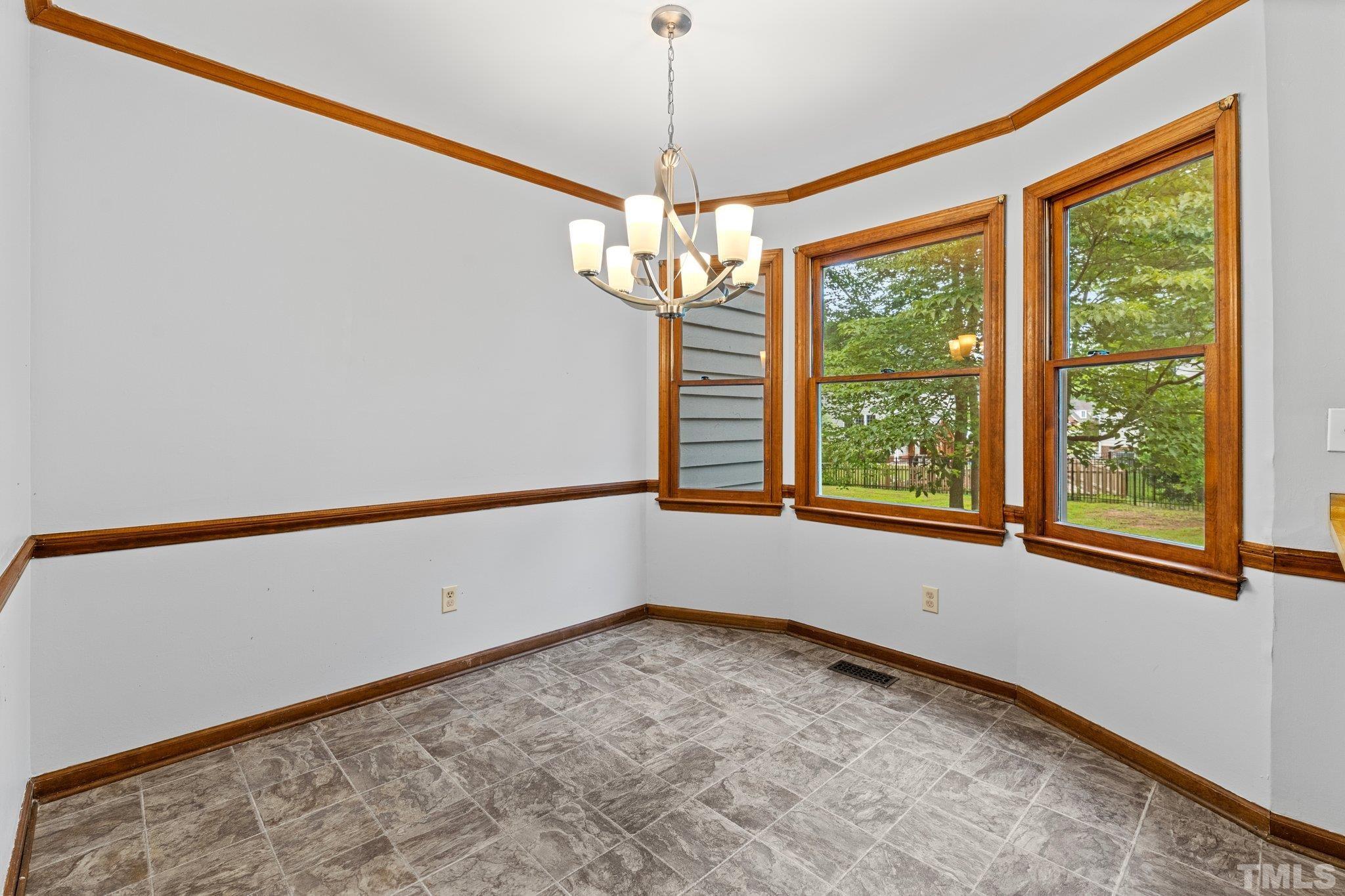 8317 Dunwood Court Raleigh, NC 27613 - Photo 16 of 50 a view of an empty room with a window