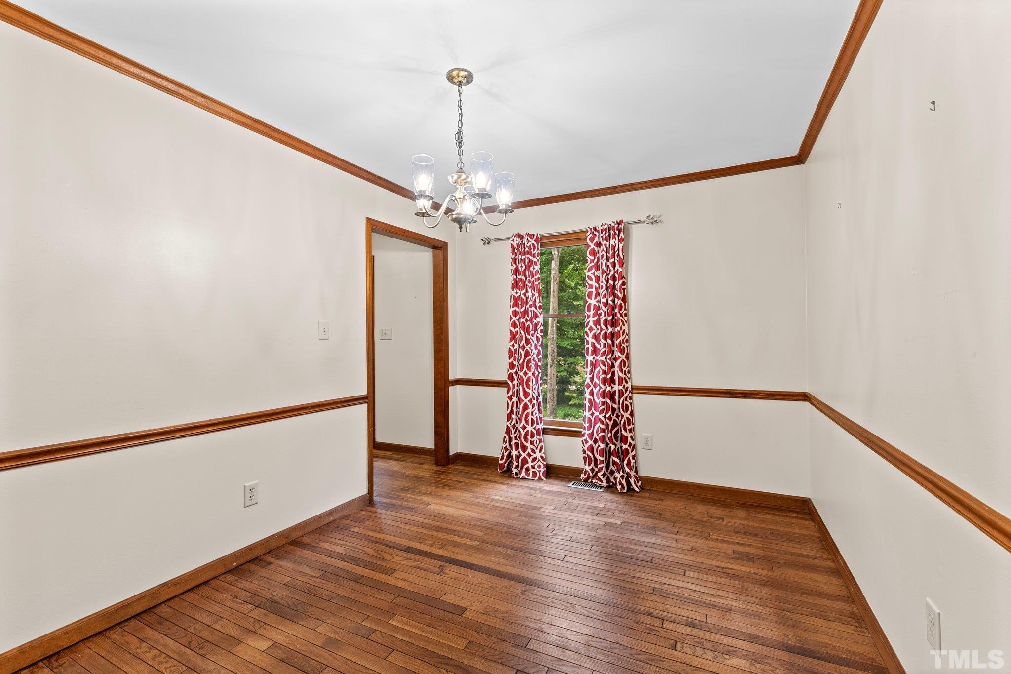 8317 Dunwood Court Raleigh, NC 27613 - Photo 18 of 50 a view of an entryway with wooden floor