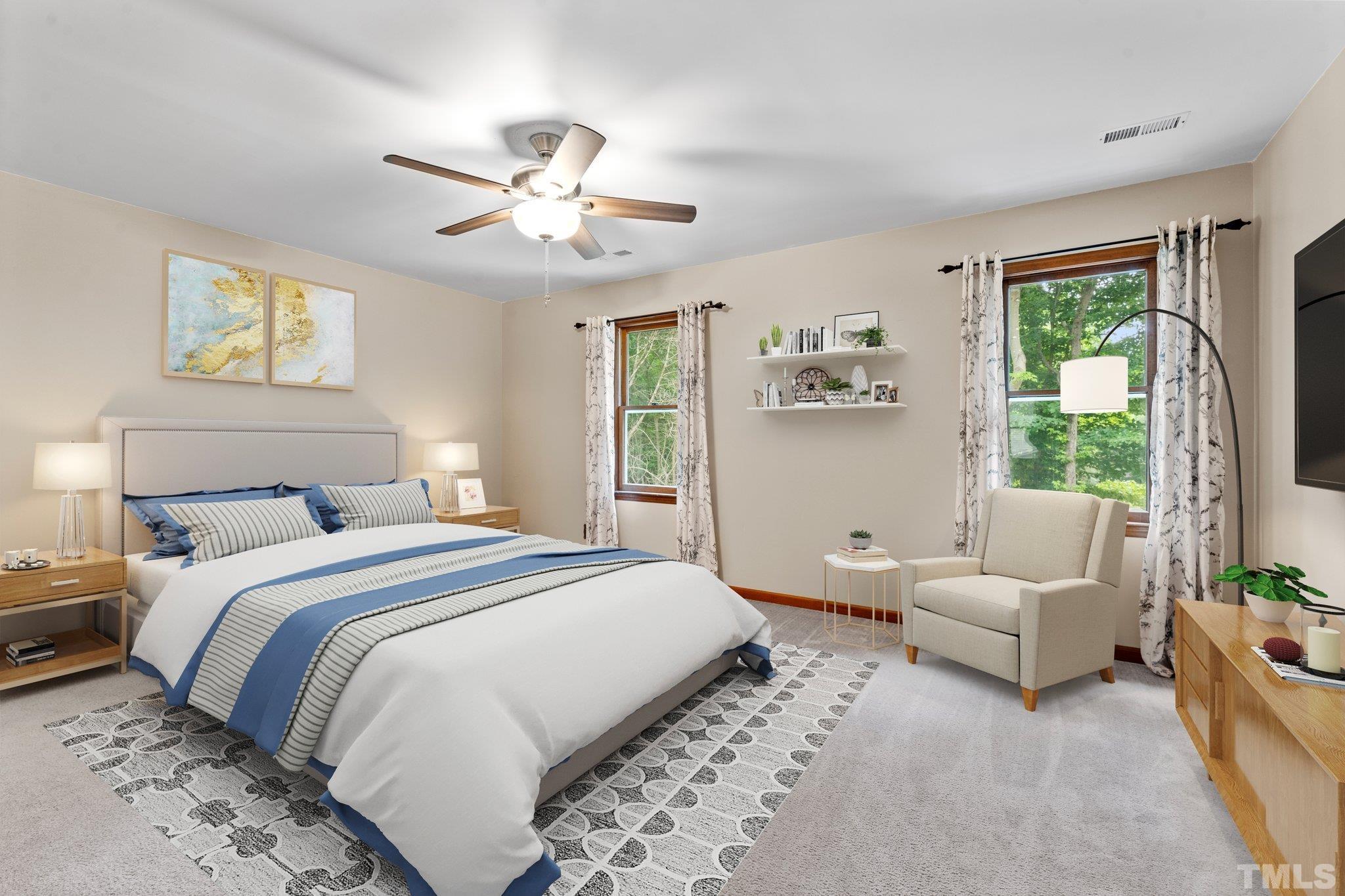 8317 Dunwood Court Raleigh, NC 27613 - Photo 20 of 50 a bedroom with a large bed and a window