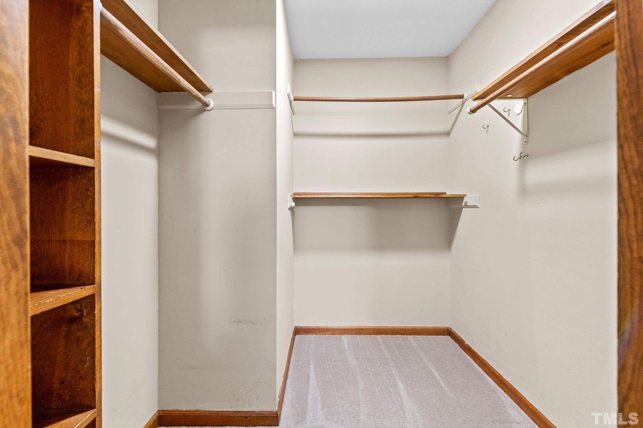 8317 Dunwood Court Raleigh, NC 27613 - Photo 23 of 50 a view of a room with racks on the wall