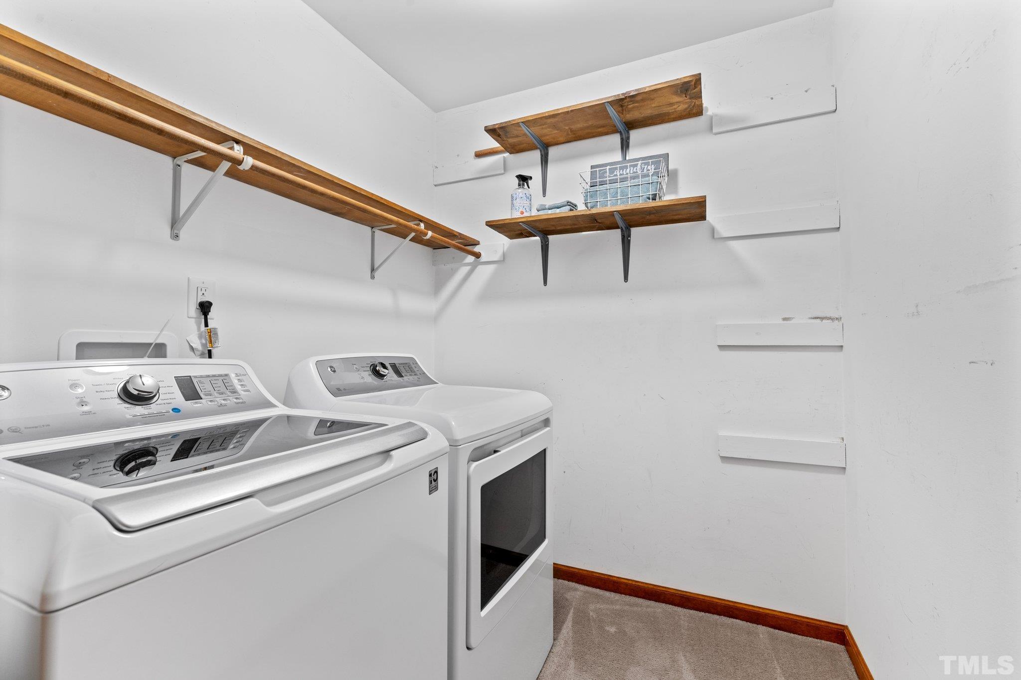8317 Dunwood Court Raleigh, NC 27613 - Photo 32 of 50 a utility room with dryer and washer