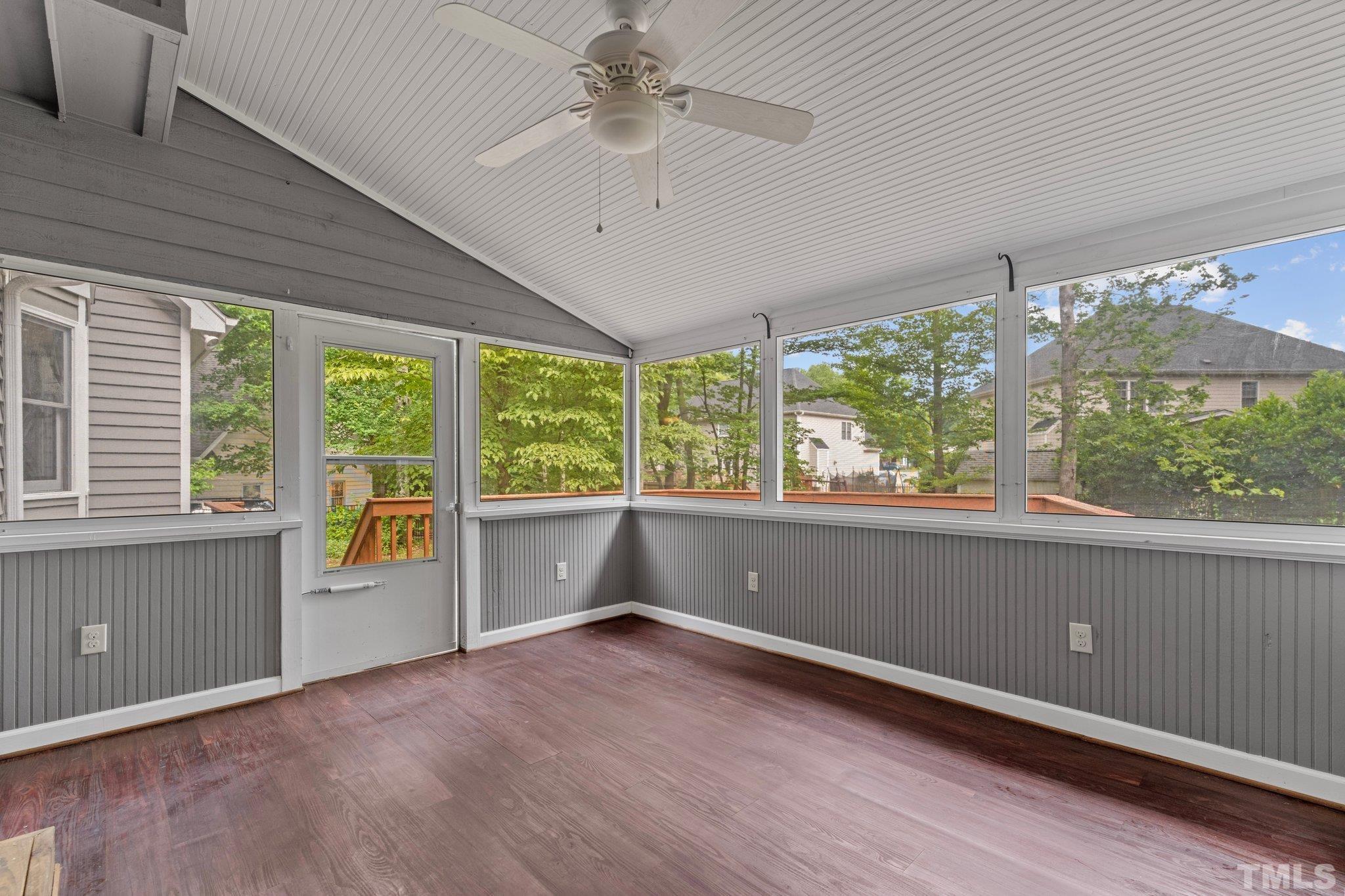 8317 Dunwood Court Raleigh, NC 27613 - Photo 34 of 50 wooden floor in an empty room with a window