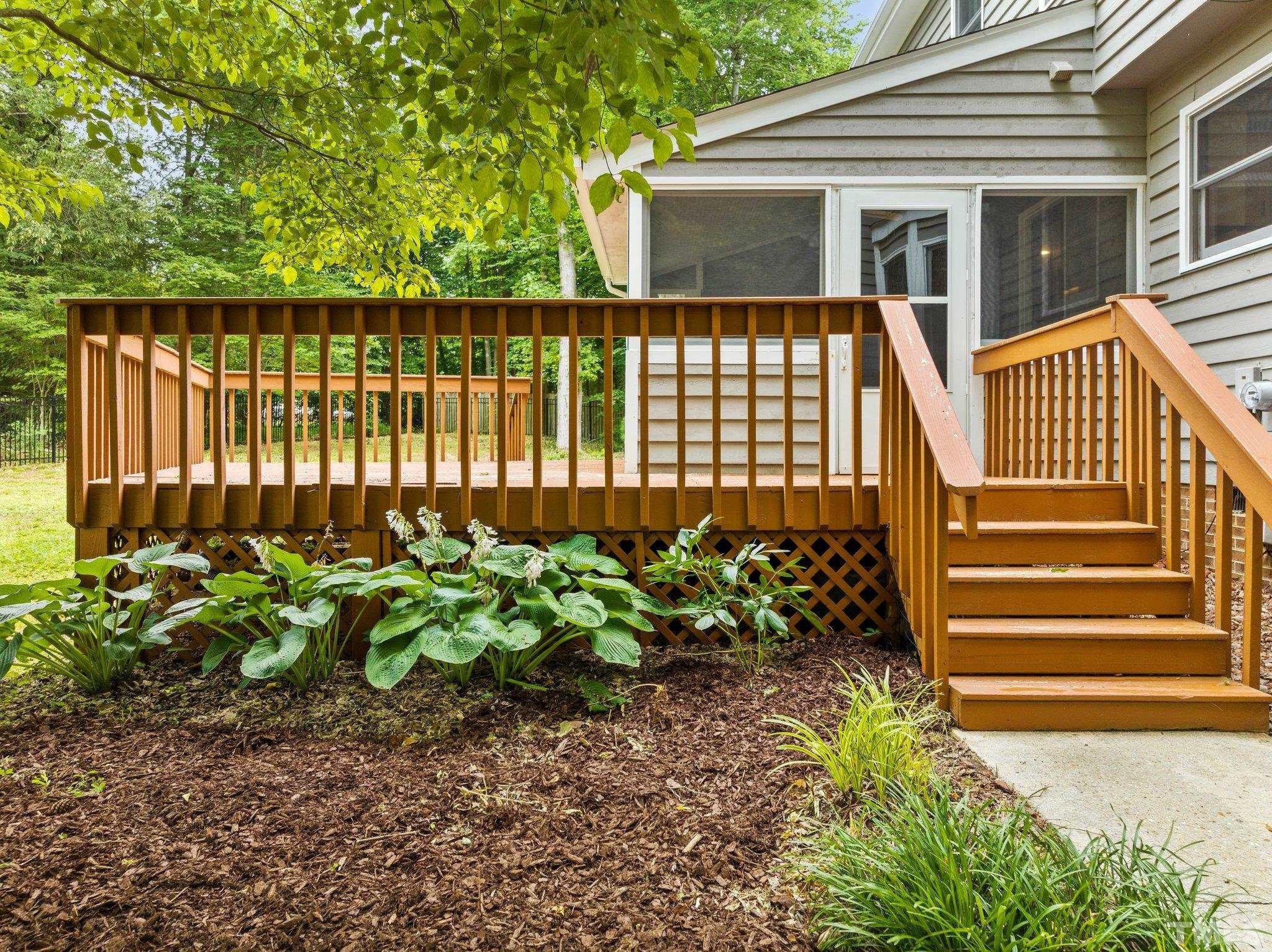 8317 Dunwood Court Raleigh, NC 27613 - Photo 35 of 50 a view of a house with a flower garden