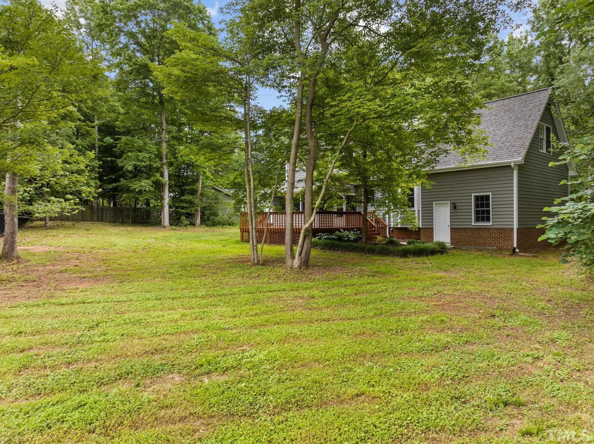 8317 Dunwood Court Raleigh, NC 27613 - Photo 36 of 50 a view of a house with a yard