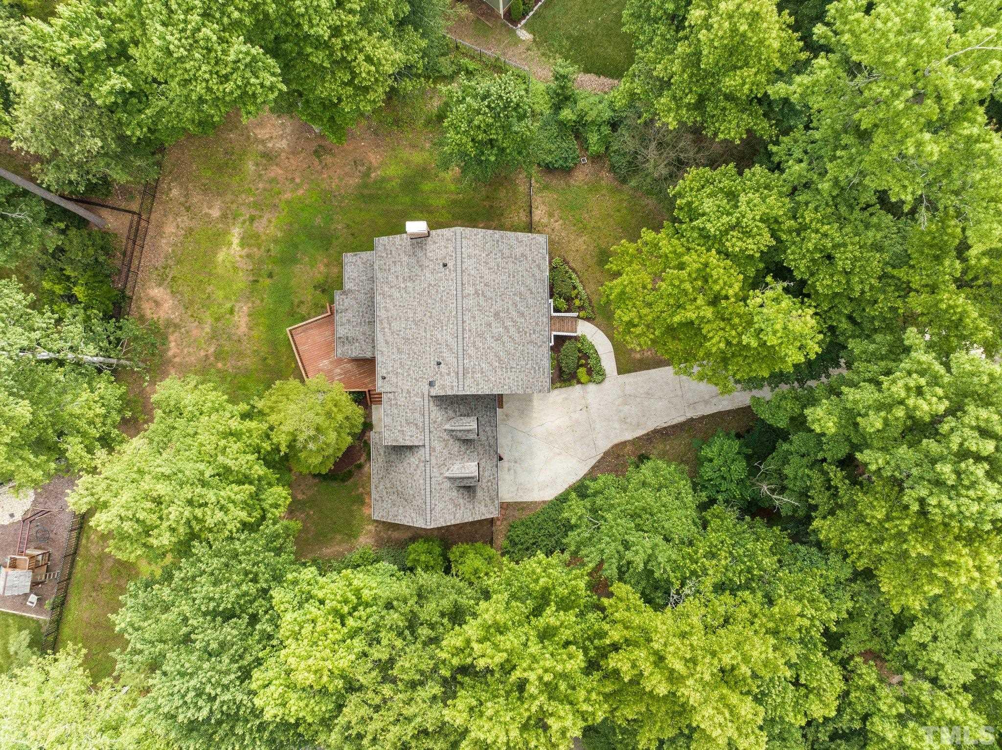 8317 Dunwood Court Raleigh, NC 27613 - Photo 46 of 50 an aerial view of a house with a yard and large tree
