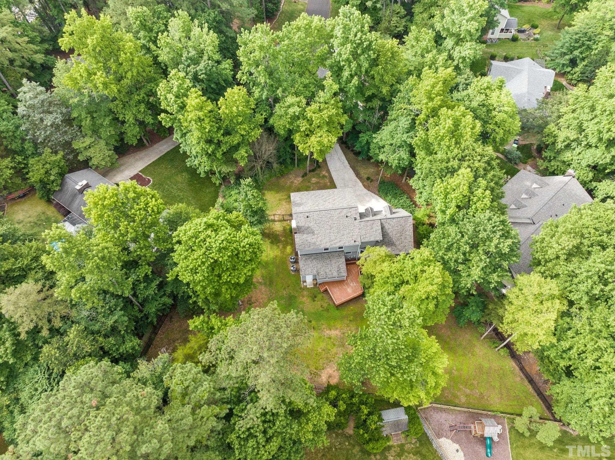 8317 Dunwood Court Raleigh, NC 27613 - Photo 47 of 50 an aerial view of a house with swimming pool and garden