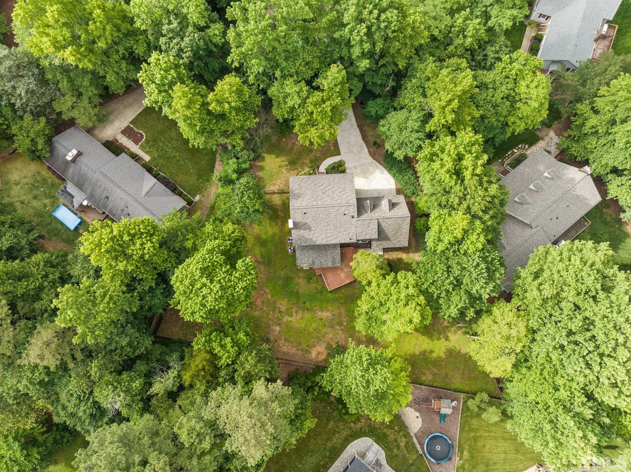 8317 Dunwood Court Raleigh, NC 27613 - Photo 48 of 50 an aerial view of a house with garden space and street view