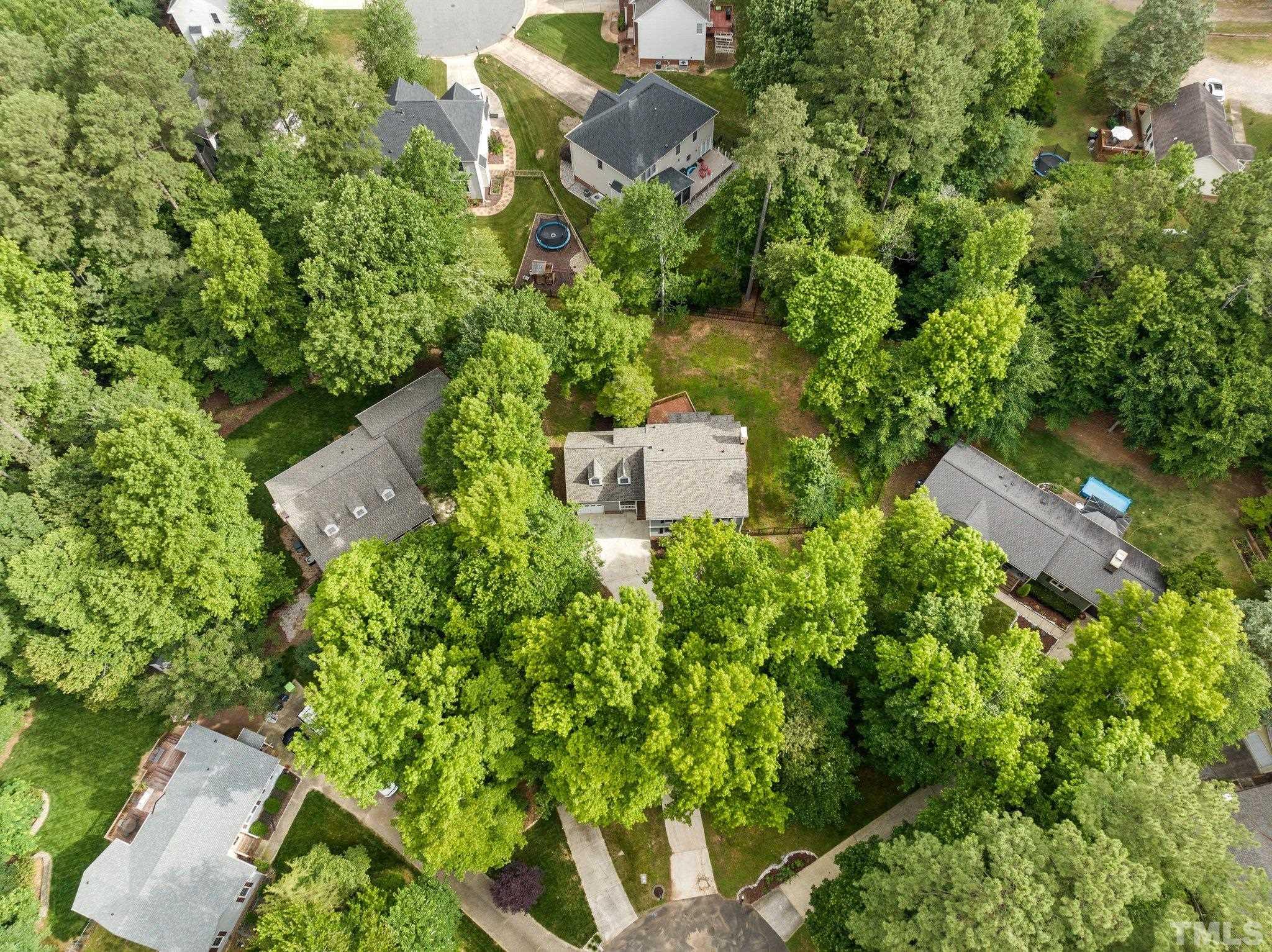 8317 Dunwood Court Raleigh, NC 27613 - Photo 49 of 50 an aerial view of residential house with outdoor space and trees all around