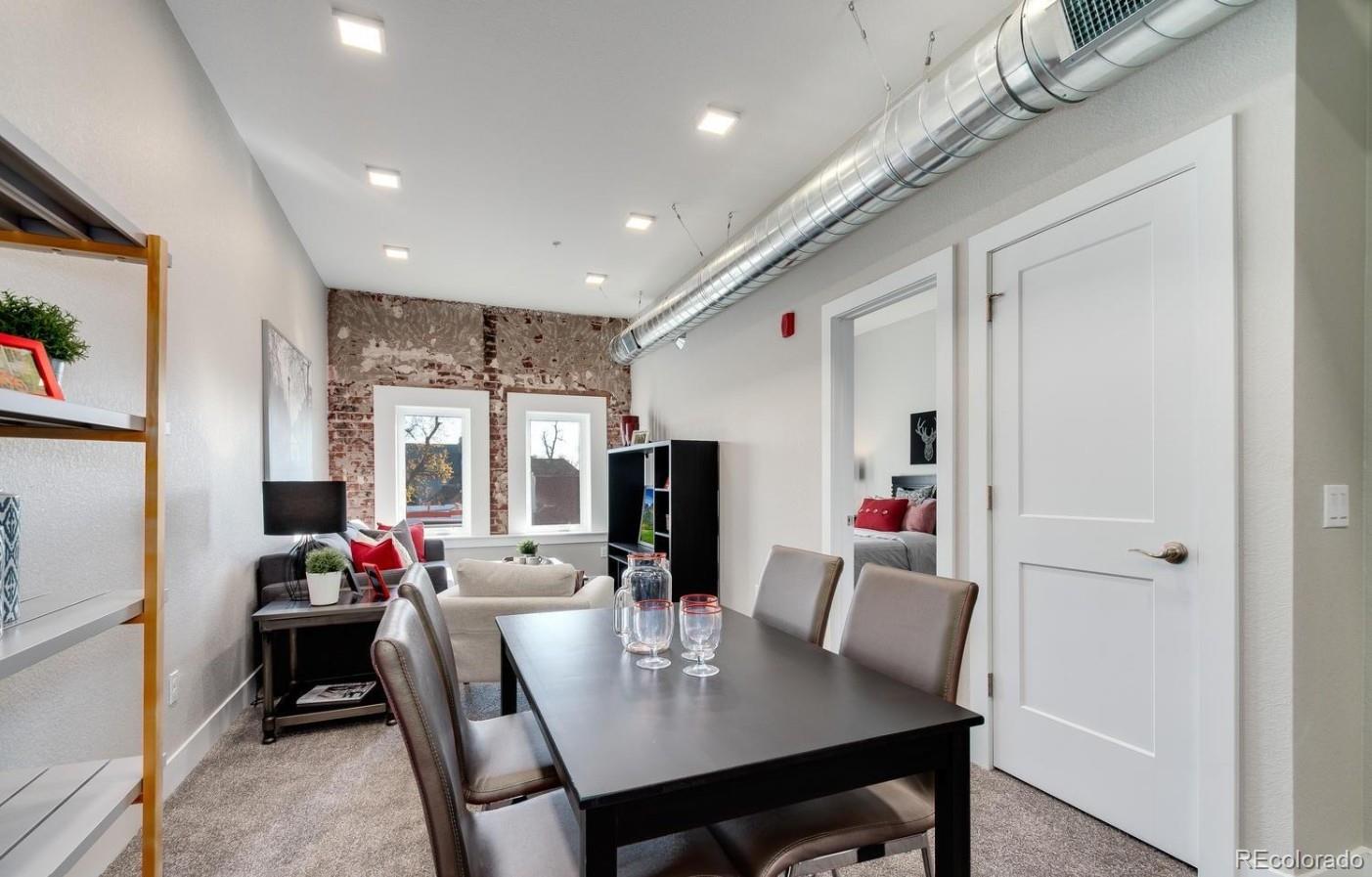 300 South Logan Street, Unit 210 Denver, CO 80209 - Photo 11 of 22 a view of a dining room with furniture