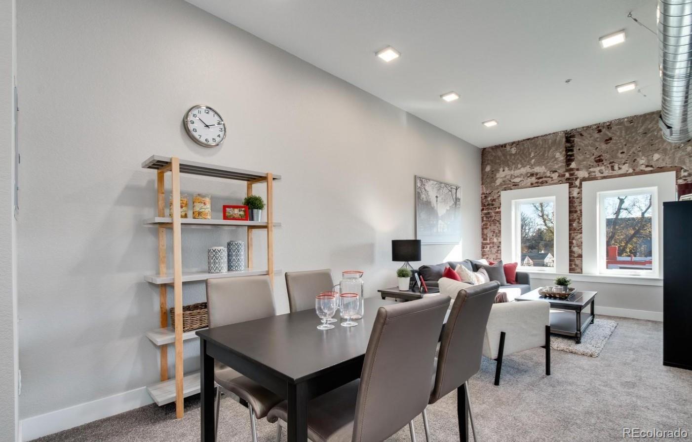 300 South Logan Street, Unit 210 Denver, CO 80209 - Photo 13 of 22 a view of a dining room with furniture window and outside view
