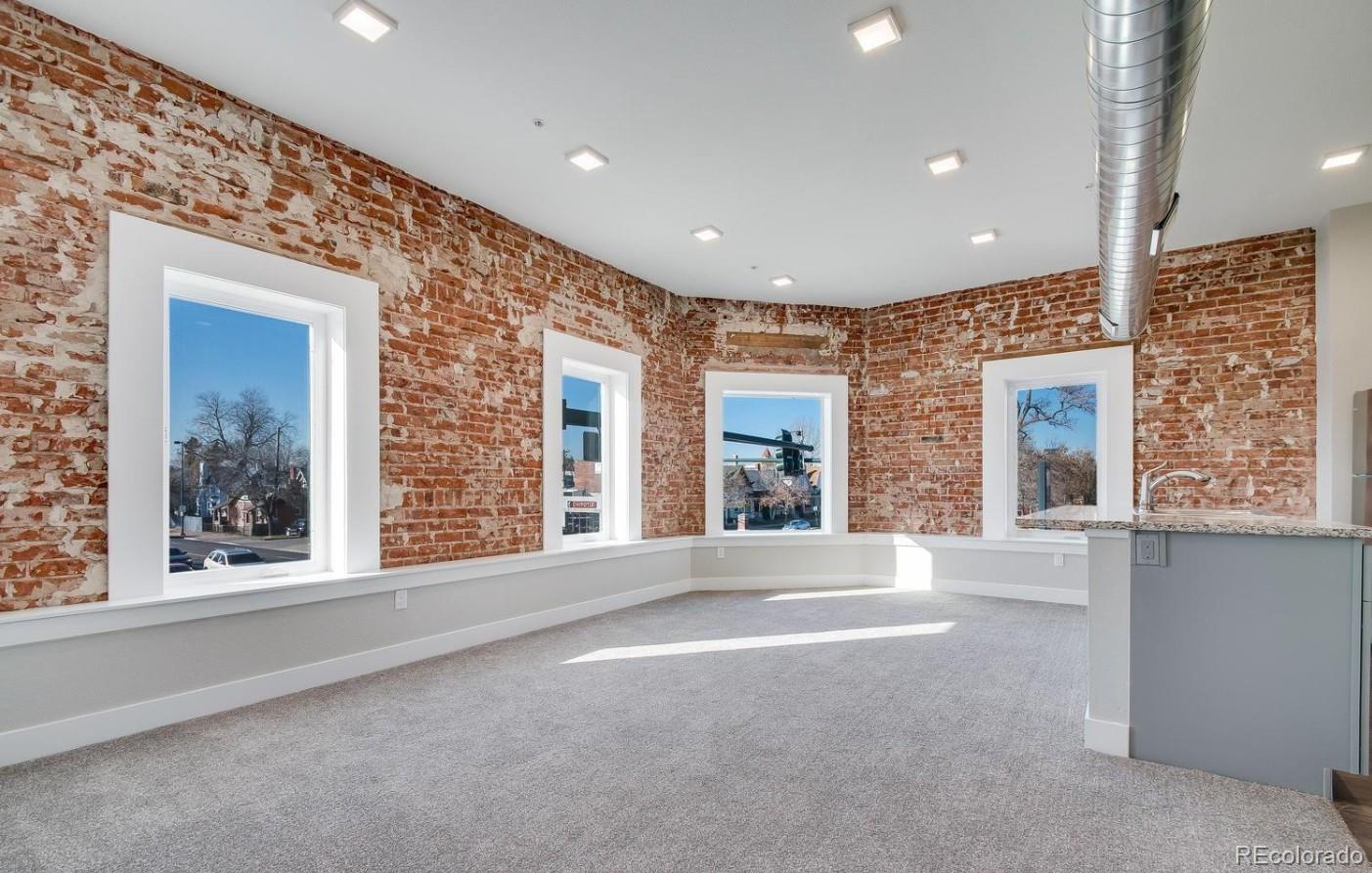 300 South Logan Street, Unit 210 Denver, CO 80209 - Photo 20 of 22 a view of an empty room with a window