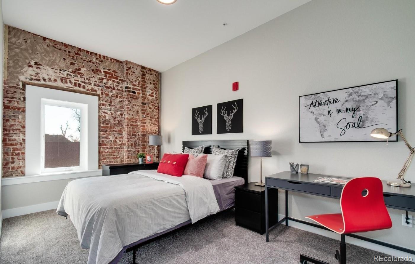 300 South Logan Street, Unit 210 Denver, CO 80209 - Photo 4 of 22 a bedroom with a bed and window