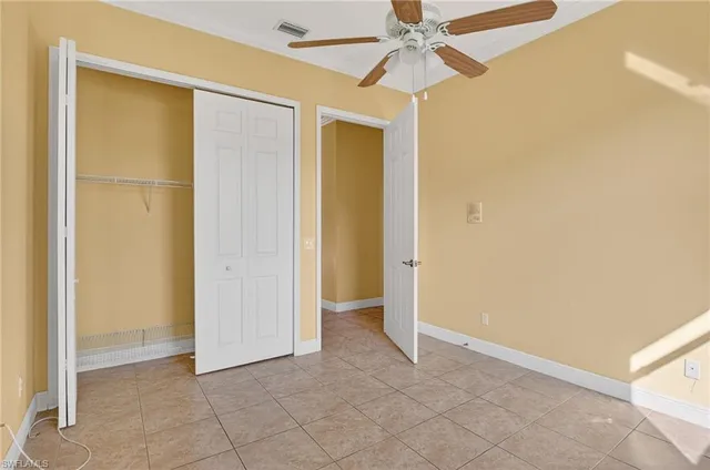 a view of an empty room with a fan