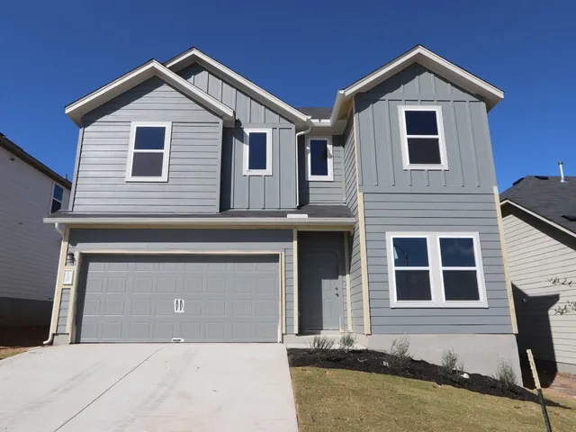 a front view of a house with yard