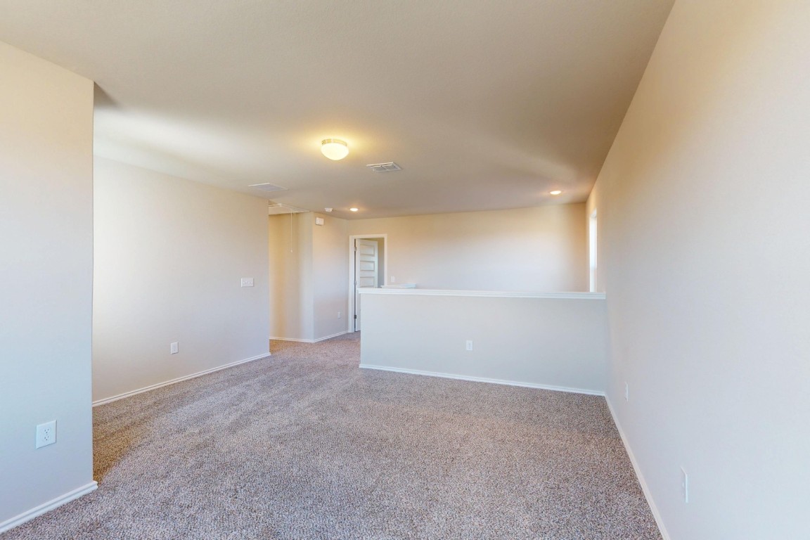 12300 Dillon Fls Drive Austin, TX 78747 - Photo 17 of 40 an empty room with windows