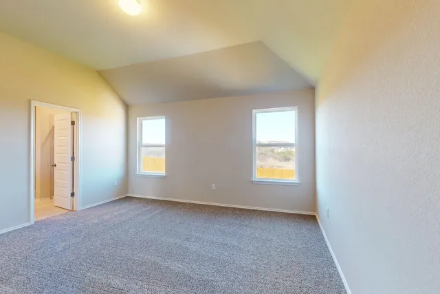 a spacious bathroom with a double vanity sink and a mirror