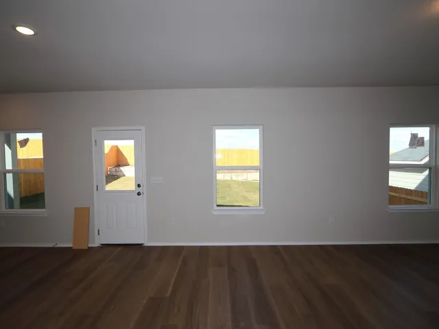 a view of an empty room and window