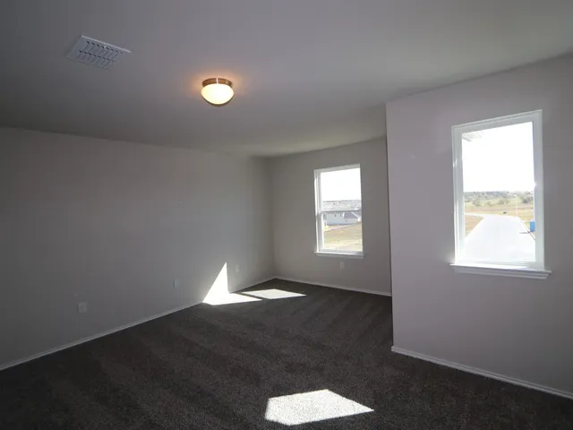 a view of an empty room and window
