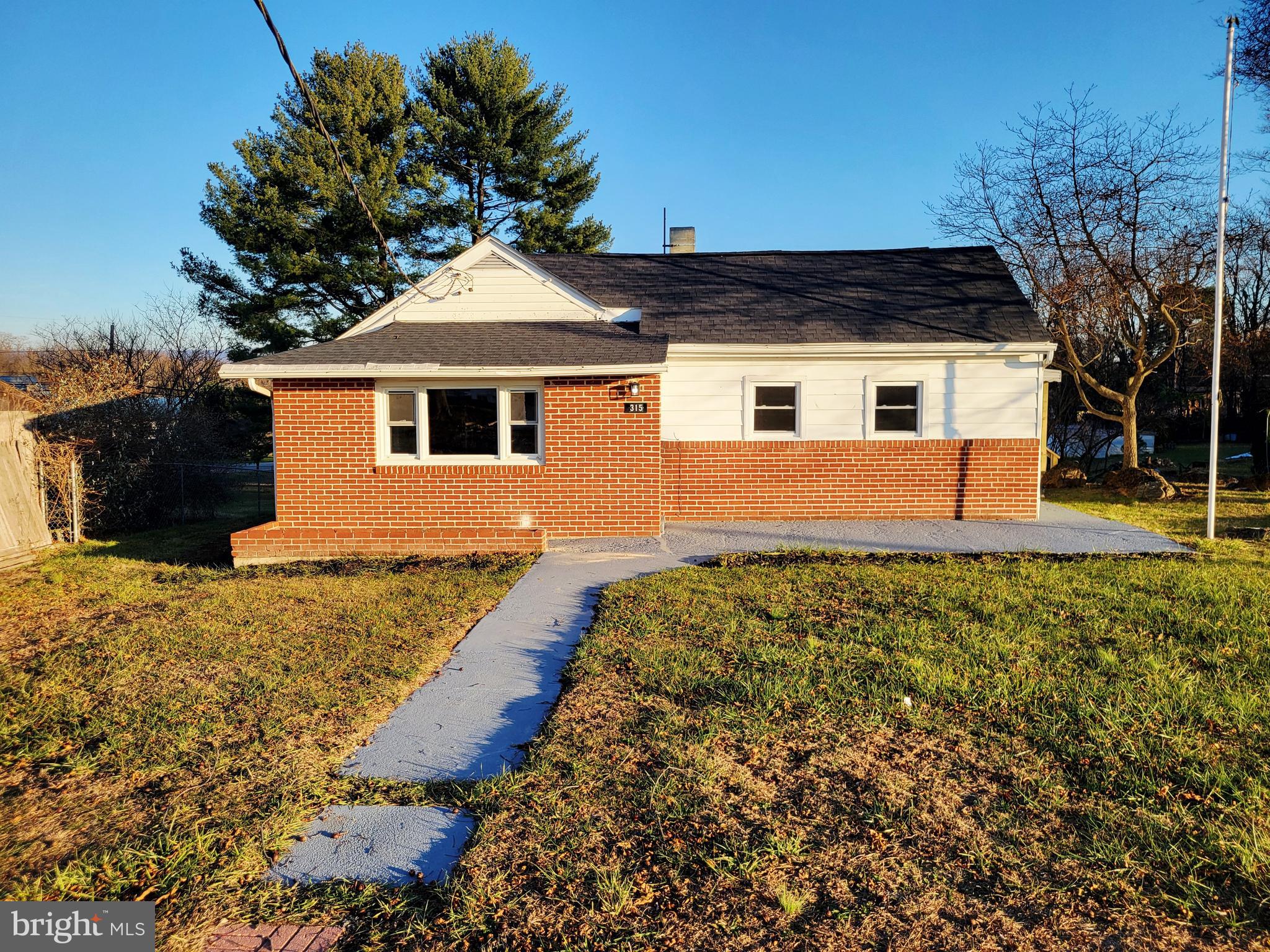 front view of a house with a yard