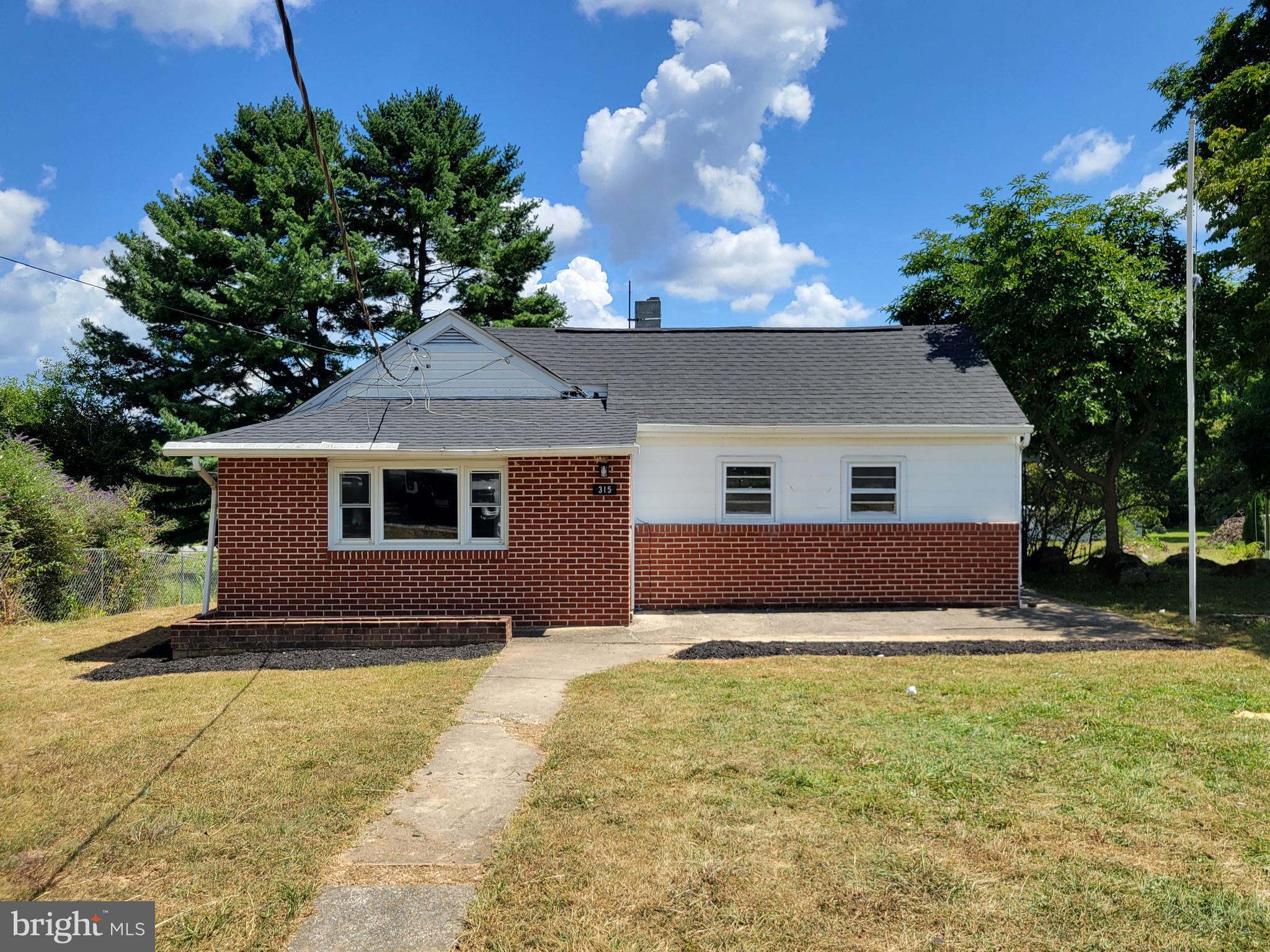 315 Emmert Road Hagerstown, MD 21740 - Photo 11 of 11 a front view of house with yard and trees in the background
